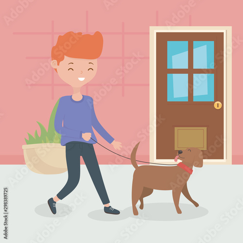 boy with dog walking in the room pet care