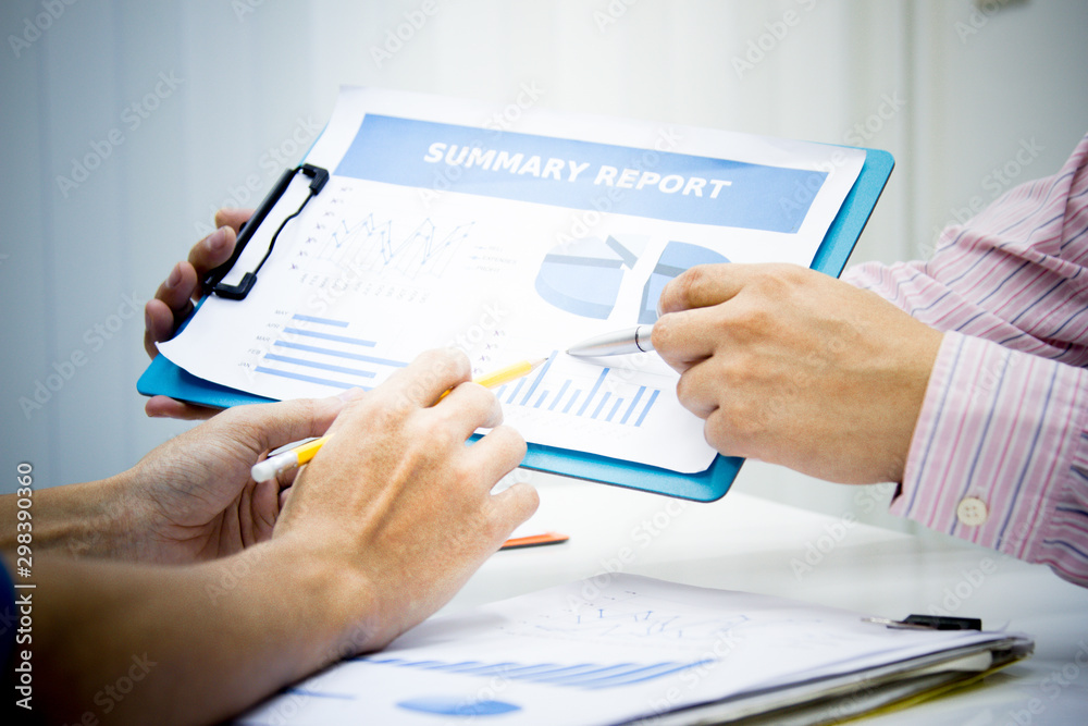 businessman working use present for Economic outlook in office for discussing documents and ideas , with soft focus, vintage tone businessman working use present for Economic outlook in office for discussing documents and ideas , with soft focus, vintage tone