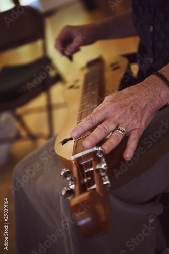 Hands performing music, painting and gardening crafts