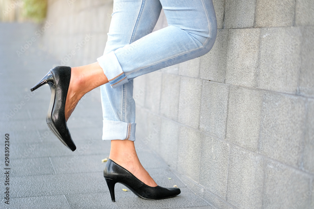 Girl in Black High Heels and Gray Jeans. Lower Half Body on Gray  Background. Stock Image - Image of human, long: 118810589