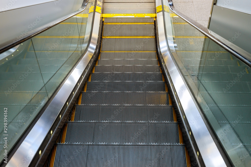 Interior design empty escalator stairs in the airport Interior design empty escalator stairs in the airport
