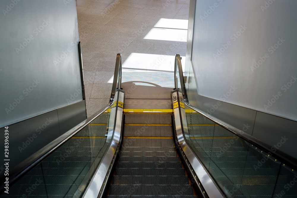Moving escalator in the automatic stairs international airport. Moving escalator in the automatic stairs international airport.