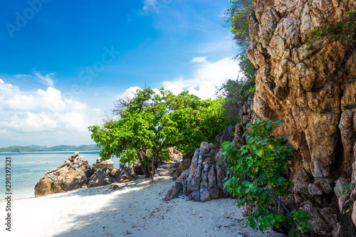 Tropical island rock on the beach with blue sky. Koh kham pattaya thailand.
