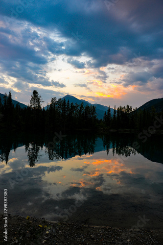 sunset reflection of mountain at lake