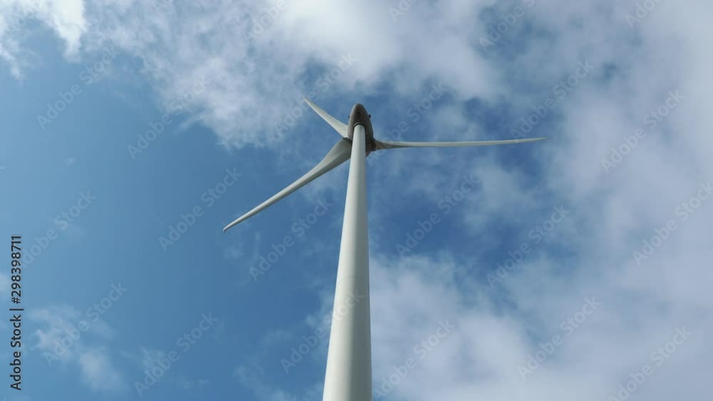Detail of wind turbine. The generator and base of the wind turbines. Renewable energy. Electrical windmills. France countryside Detail of wind turbine. The generator and base of the wind turbines. Renewable energy. Electrical windmills. France countryside