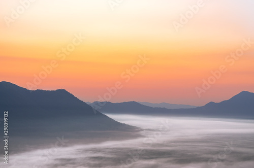 Mountain range with visible silhouettes through the morning fog at Phu Tok Mountain in Chiang Khan district, Loei province.