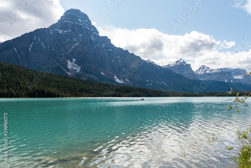 Lake mountains and a boat © Makram Studios