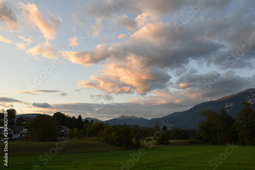 Last light, sun setting on clouds and mountain, landscape, Bled, Slovenia