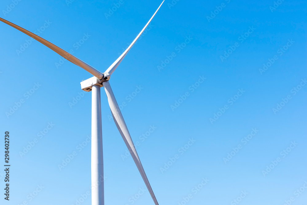 Wind turbine is alternative electrical power with blue sky, summer field, renewable energy Wind turbine is alternative electrical power with blue sky, summer field, renewable energy