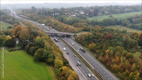 Aerial hyperlapse, timlapse of British motorway by drone. Busy, junction, transportation. Commuters