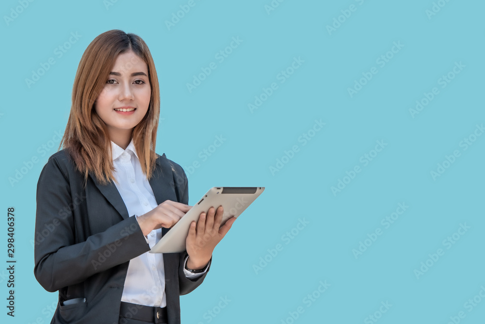 Asian business woman with tablet computer isolated on blue banner background with copy space. Asian business woman with tablet computer isolated on blue banner background with copy space.