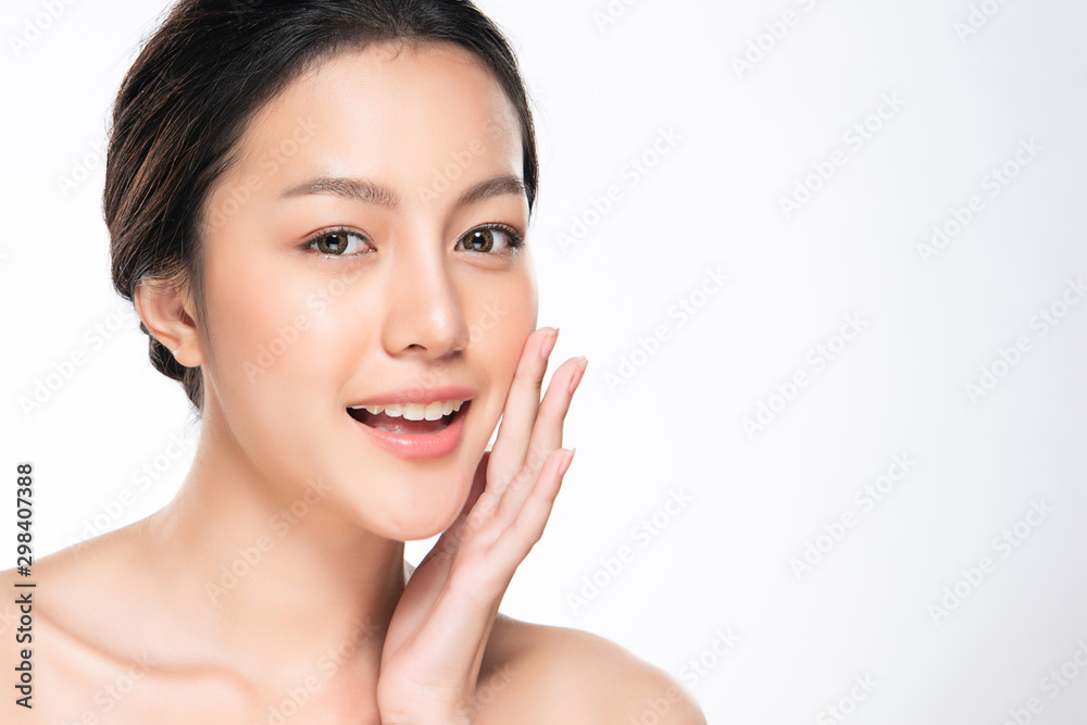 Beautiful young Asian woman touching soft cheek and smile with clean and fresh skin. Happiness and cheerful with, isolated on white background, Beauty and Cosmetics Concept,