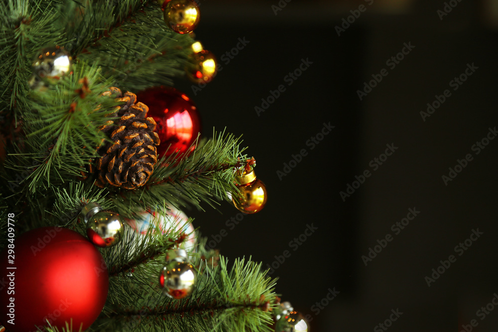 Decorated Christmas tree with black background and copy space. Decorated Christmas tree with black background and copy space.