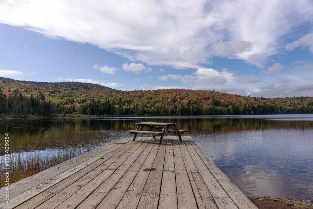 Resting place on the wooden pier at the lake in Mont Tremblant National Park. Quebec. Canada