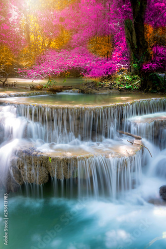 Fototapeta Naklejka Na Ścianę i Meble -  Amazing in nature, beautiful waterfall at colorful autumn forest in fall season