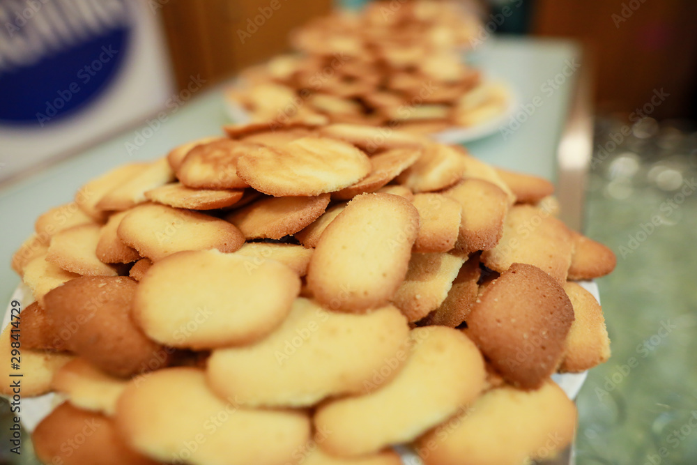 Fototapeta premium Shallow depth of field image with lots of cookies on a plate
