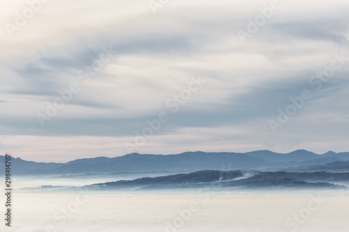 A view of Umbria valley with layers of hills and mountains and mist