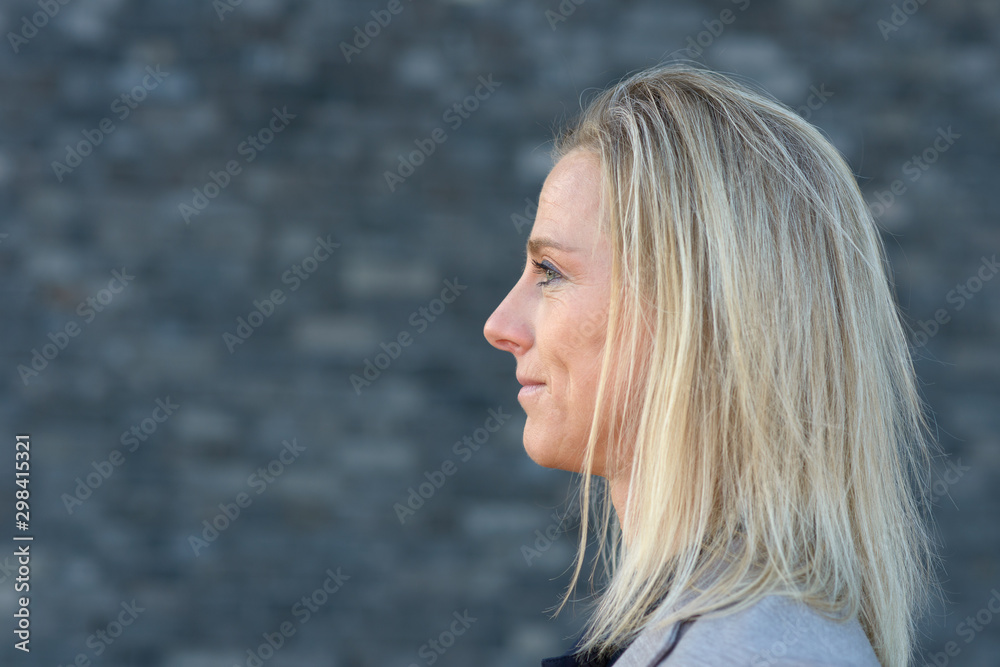 Side portrait of blond woman head in close-up Side portrait of blond woman head in close-up