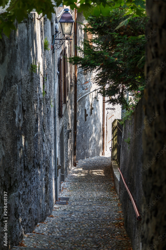 Narrow street of Varenna town on Como lake, Italy