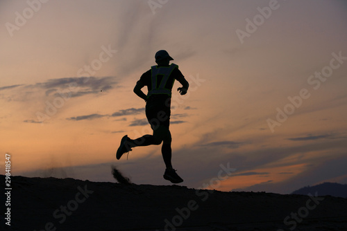 Trail running on the sand beach sunset of lifestyle men sport