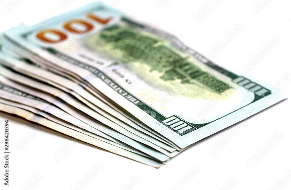 One hundred dollars. Money. Paper bills in denominations of one hundred dollars. Business and Finance. One hundred dollars. Money. Paper bills in denominations of one hundred dollars. Business and Finance.