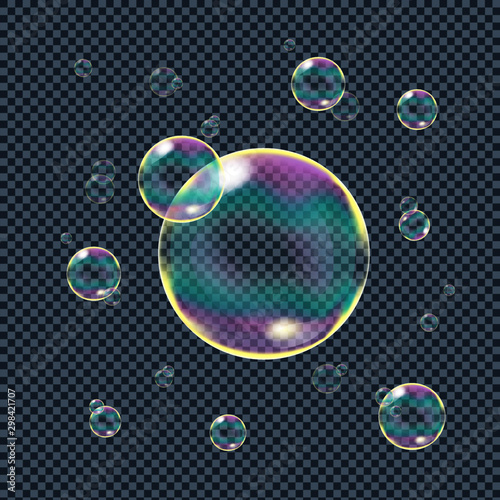 Realistic soap bubbles with rainbow reflection isolated on transparent background. Vector illustration.