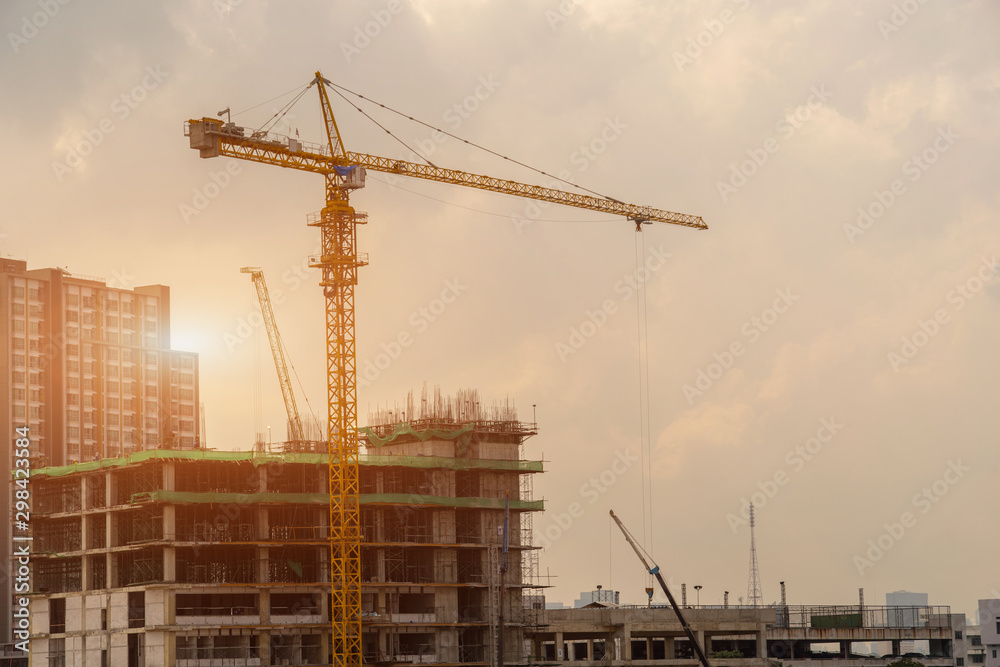 Construction crane,Building crane and buildings under construction,Heavy construction industry. Construction crane,Building crane and buildings under construction,Heavy construction industry.