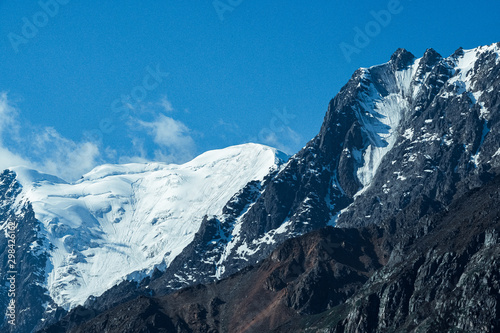 Snow cliffs under blue sky. Travel in  mountains © Koirill