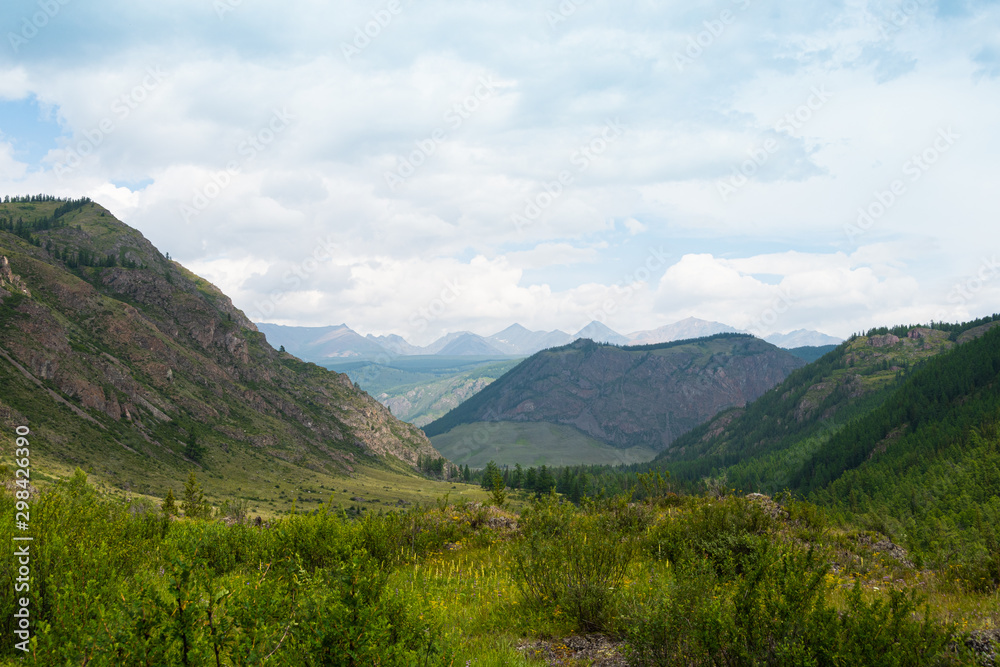 Fototapeta premium Mountain range under clouds. Rocks for Hiking and tourism
