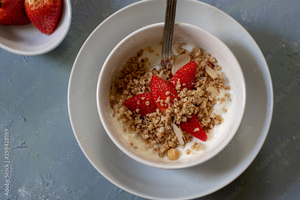 bowl of cereal with milk and strawberries bowl of cereal with milk and strawberries