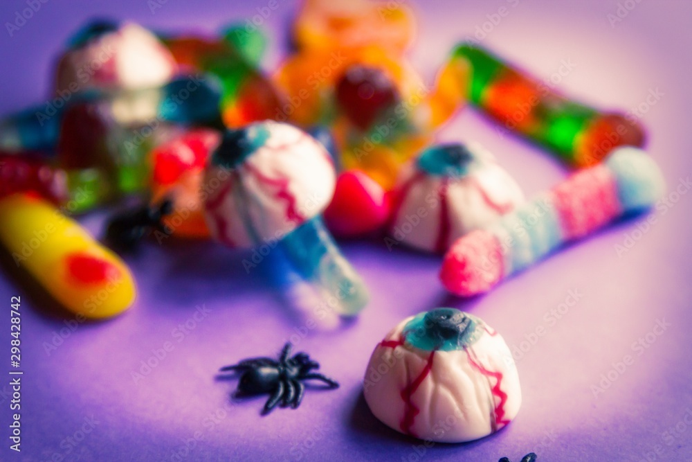 halloween candies seen close up on purple background