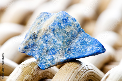 Macro photography of a lapis lazuli stone on a wicker background
