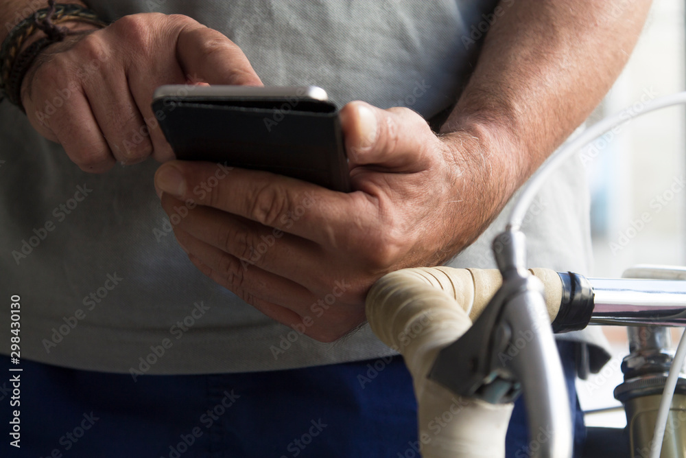 man using mobile phone in the gym man using mobile phone in the gym