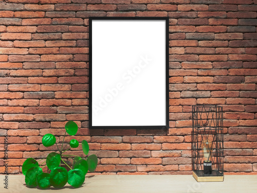 Obraz na plátně Blank framed poster on the brick wall, mock up