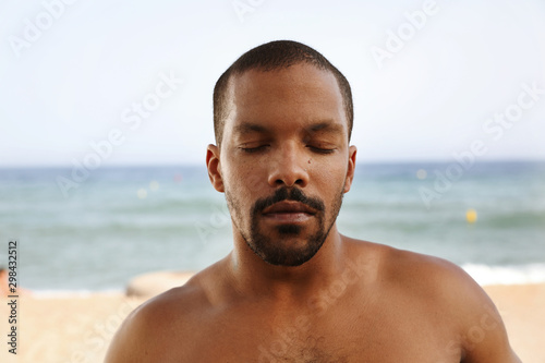 Close up portrait of young black man, enjoying summer. © face_reader_img