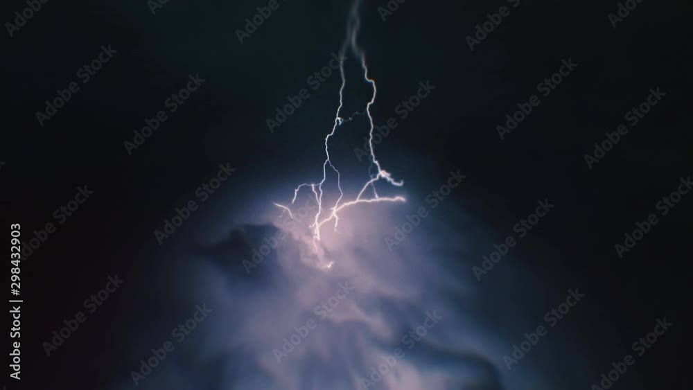 Heavy clouds bringing thunder, lightnings and storm.
Thunderstorm flashes with multiple bolts of lightning. 
Time-lapse shot.