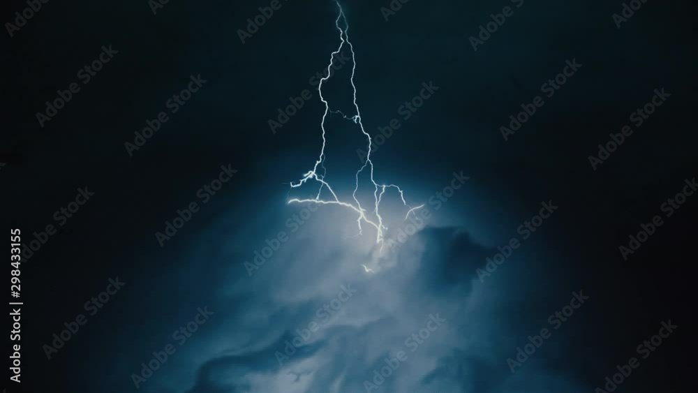Heavy clouds bringing thunder, lightnings and storm.
Thunderstorm flashes with multiple bolts of lightning. 
Time-lapse shot.