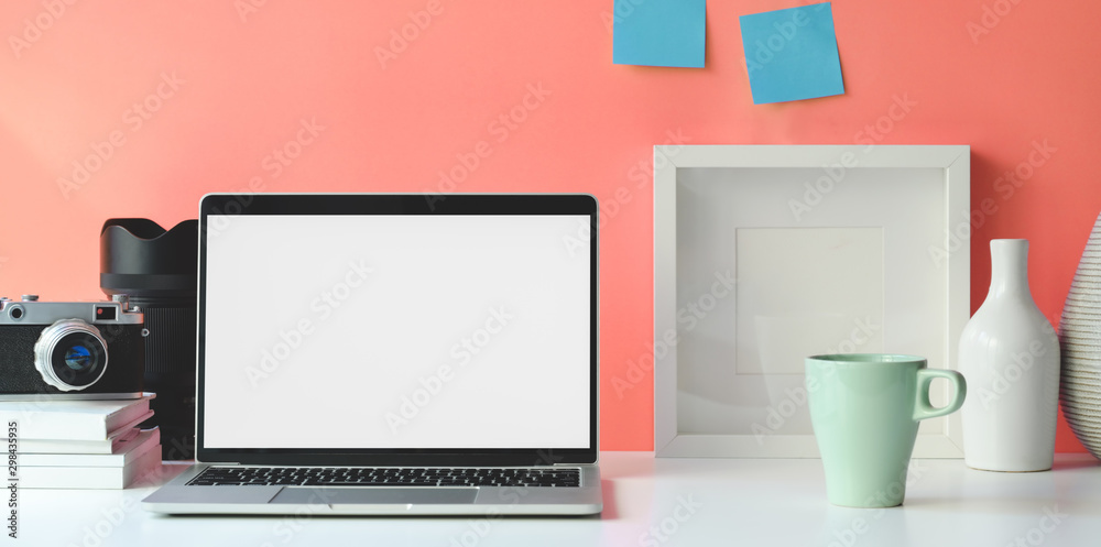Minimal workspace with open blank screen laptop computer Minimal workspace with open blank screen laptop computer