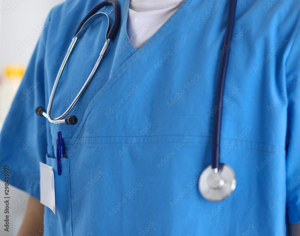 Closeup portrait of a doctor with stethoscope holding folder Closeup portrait of a doctor with stethoscope holding folder