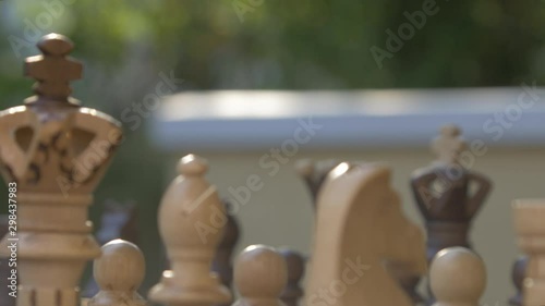 Wooden chess game on a table, fokus sharpness relocation