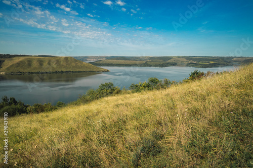 summer morning day scenic view nature reserve park hill land and lake  country side peaceful landscape outdoor environment 