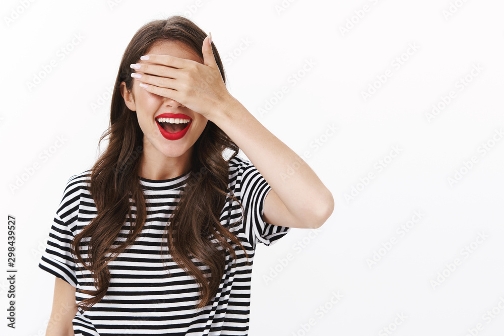 Cheerful alluring charming young b-day girl waiting receive awesome present, close eyes with palm, smiling broadly excited from anticipation open and see present, white background Cheerful alluring charming young b-day girl waiting receive awesome present, close eyes with palm, smiling broadly excited from anticipation open and see present, white background