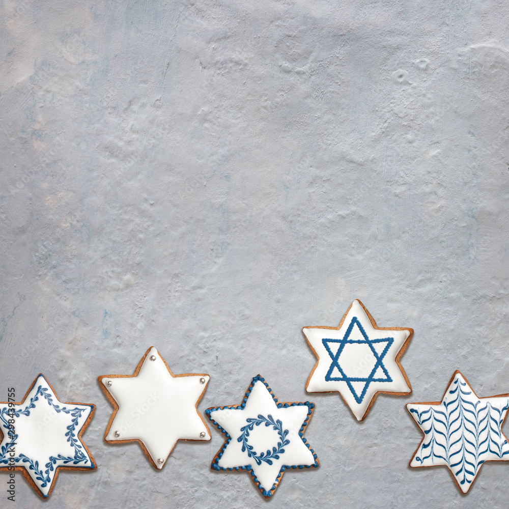 Star shaped cookies on gray stone background with Star of David Stock