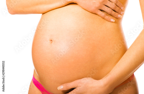 Wallpaper Mural Belly of pregnant woman in eight month on white background with copy space. Torontodigital.ca