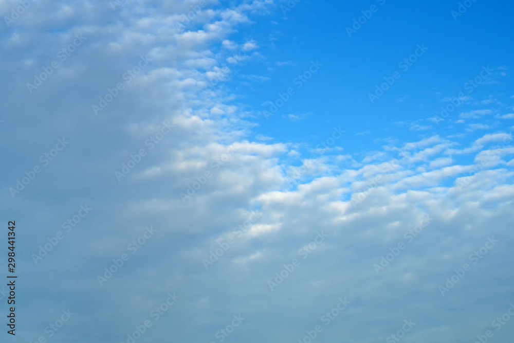 High clouds on the blue sky. Background and texture