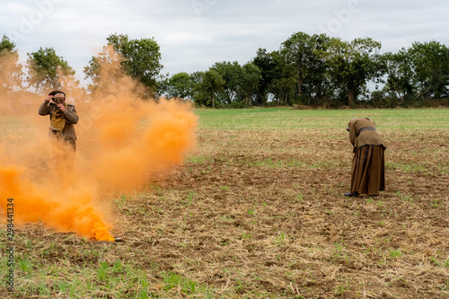 Photo WW1 battle scene depicting a mustard gas attack on British troops, depicted by the orange smoke