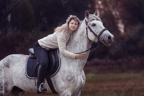 Young lady riding a horse