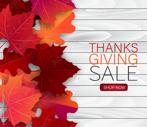 Thanksgiving sale poster.  Background with red and orange maple fall leaves on wooden board. American traditional november holiday. Banner for advertisement, promotion, invitation.