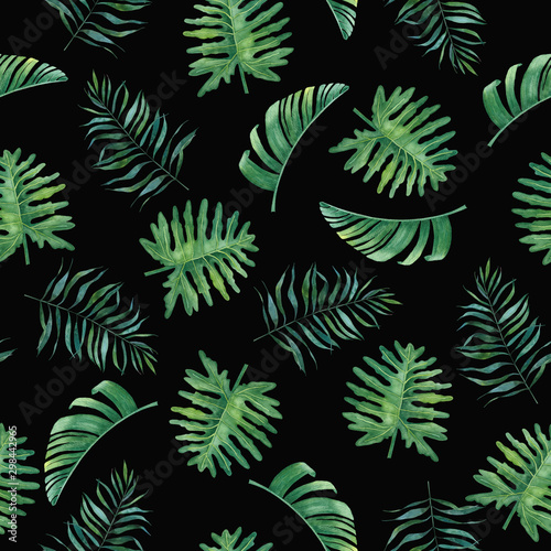 Tropical watercolor seamless pattern with palm leaves on black background for design and textiles.