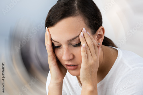 Woman Suffering From Headache Dizziness photo